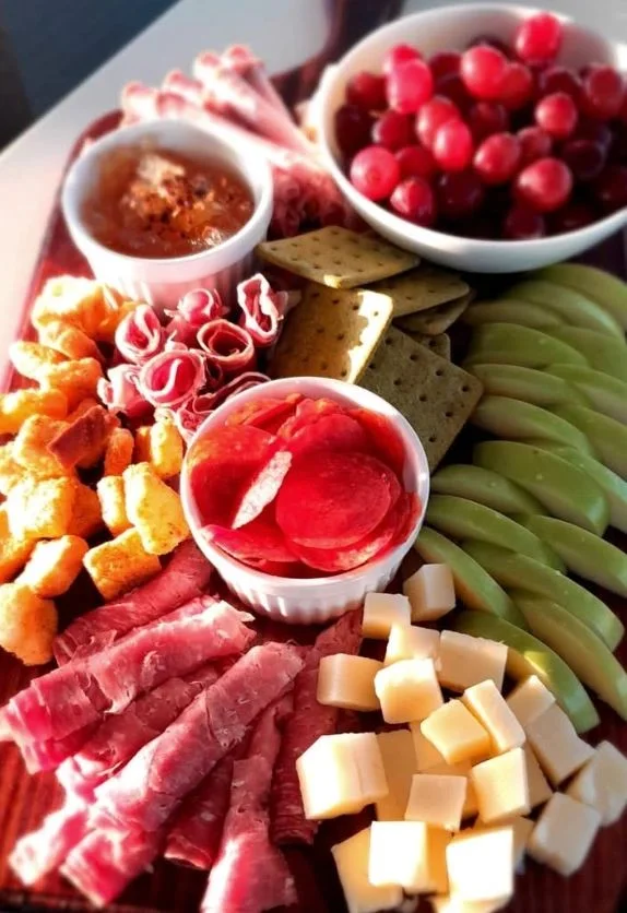 Grazing platter with fruit, cheese, crackers and charcuterie