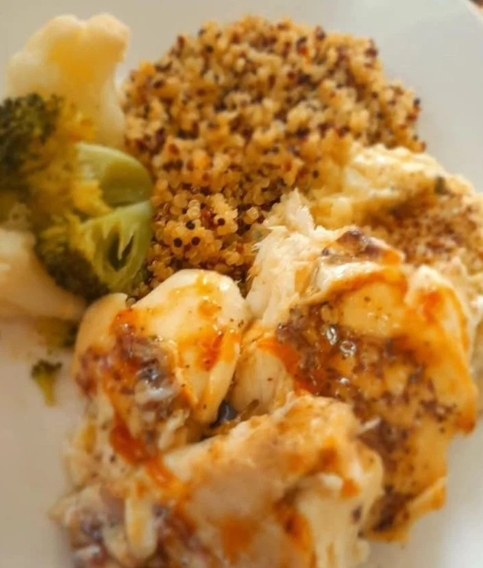 Grilled seafood served with rice and vegetables