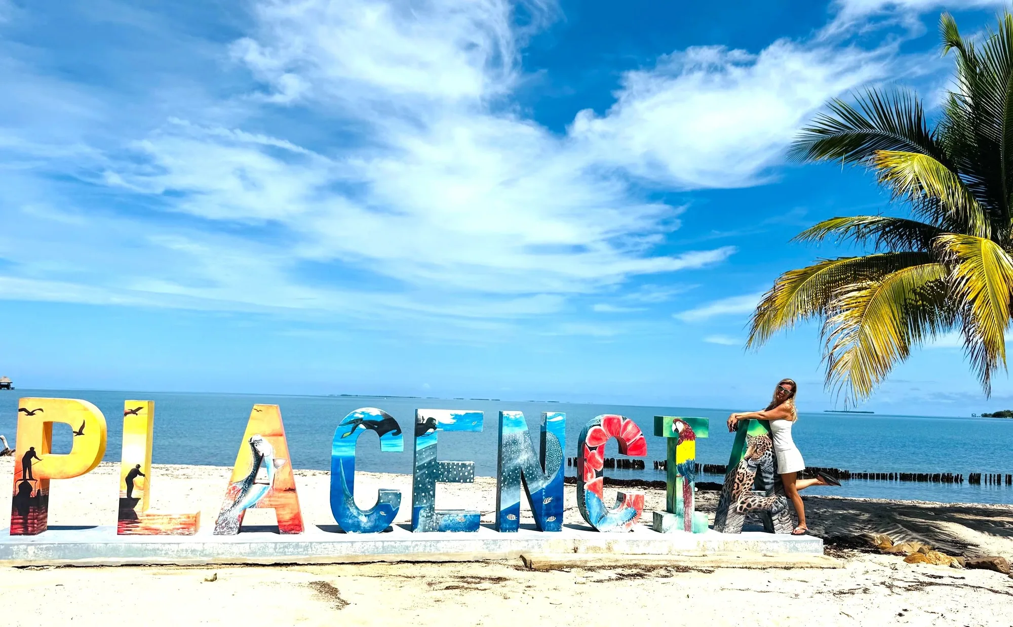 The colourful Placencia sign beside the Caribbean Sea