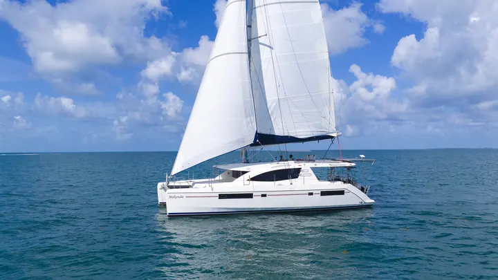 Sailing catamaran underway on Belize water