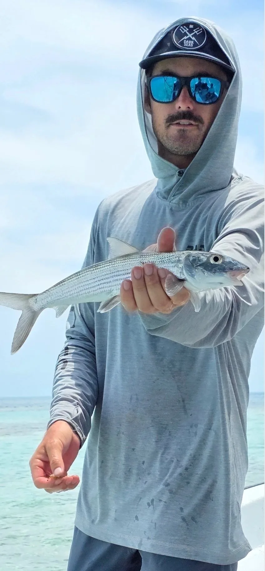 A guest enjoying a day of fishing in Belize