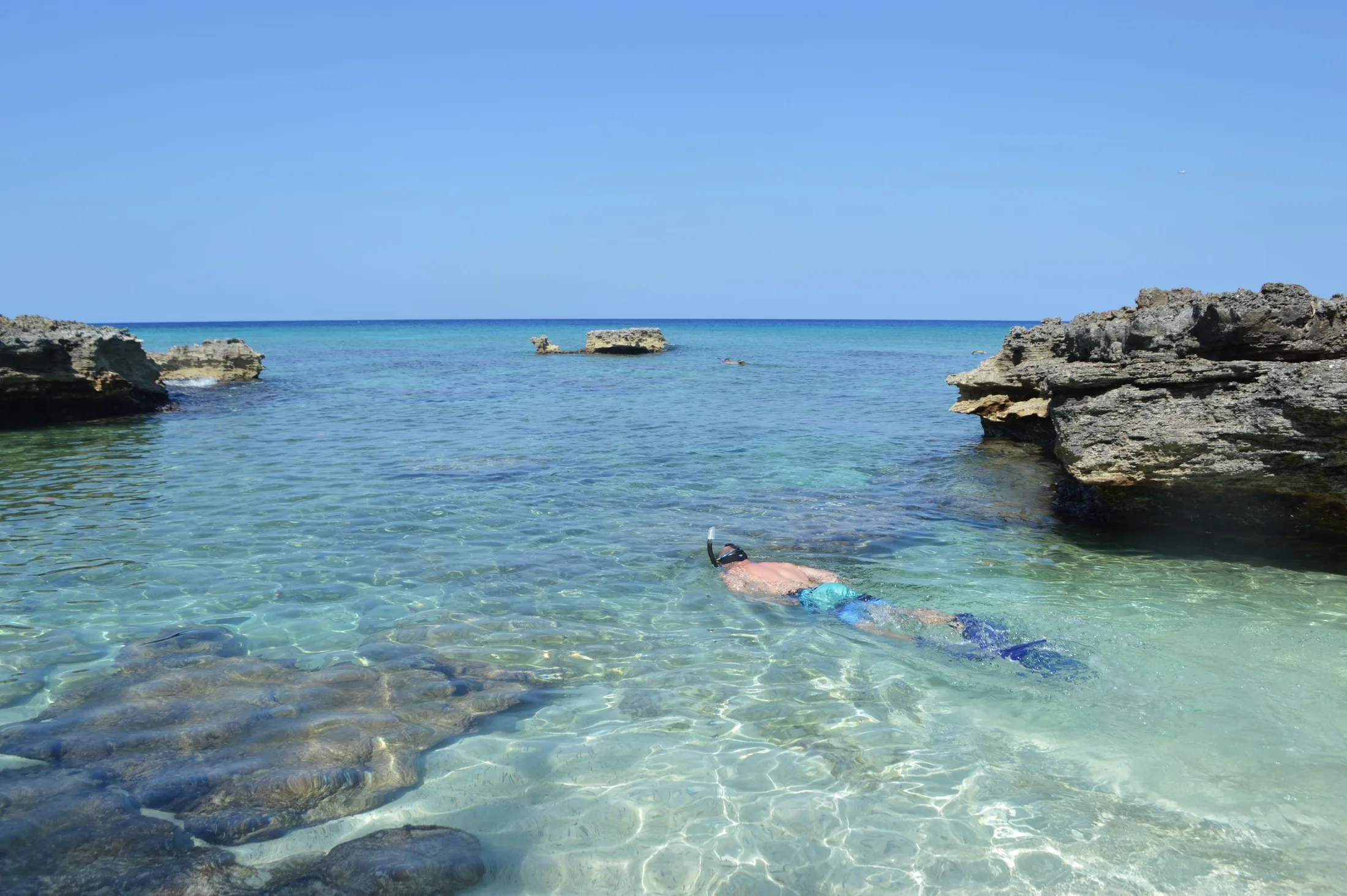 Snorkeler moving through clear tropical water