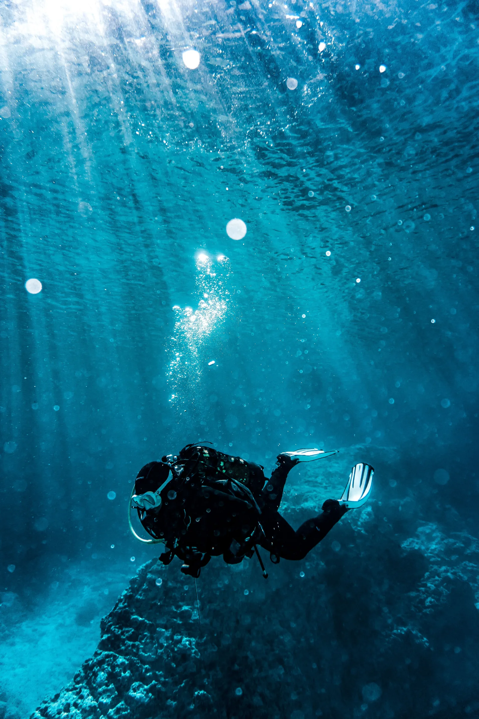 Scuba diver exploring clear turquoise water