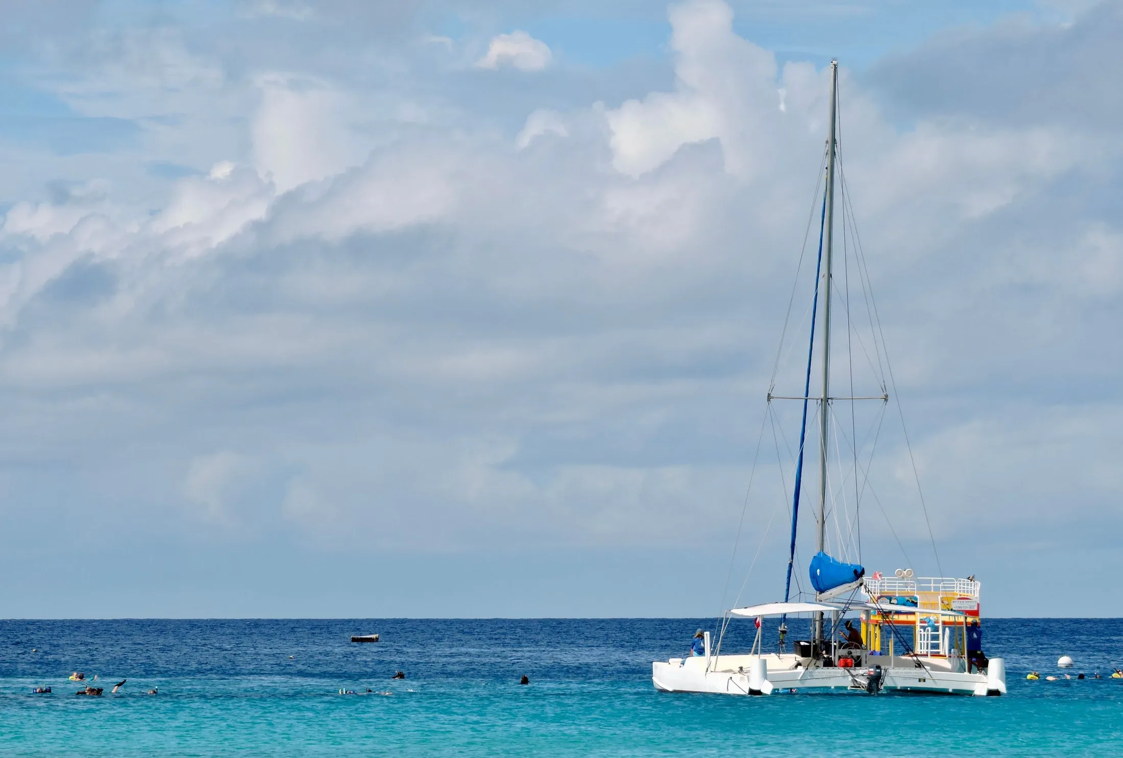 Sailing catamaran anchored on clear Caribbean water
