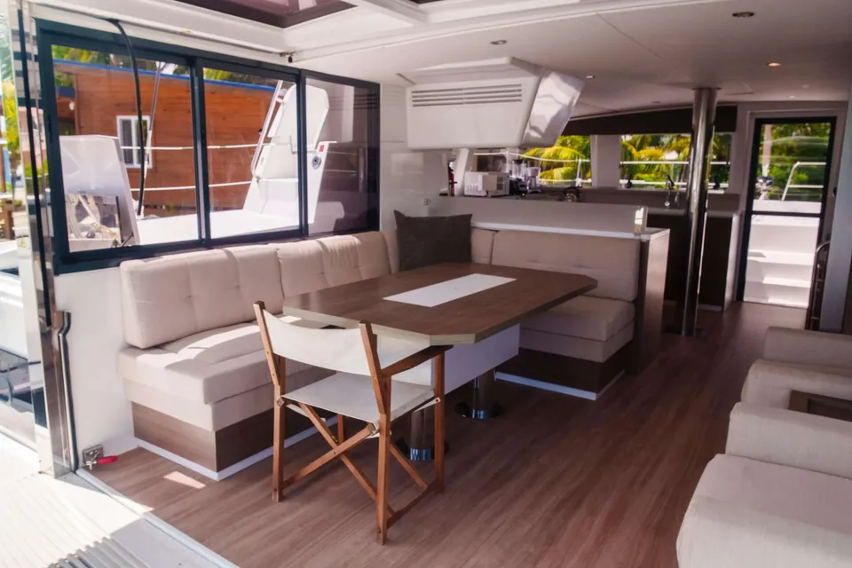 Lunara's open-plan salon with wraparound seating and dining table
